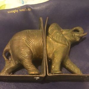 A brass elephant book holder